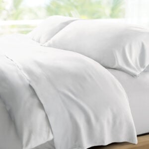 Cariloha Retreat bamboo sheets in white on a bed, highlighting softness and comfort for optimal sleep experience.