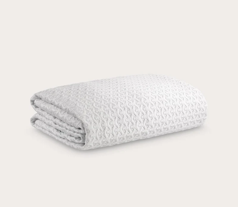 Ver-Tex Cooling Mattress Protector folded, featuring textured fabric designed for heat deflection, ideal for hot sleepers.