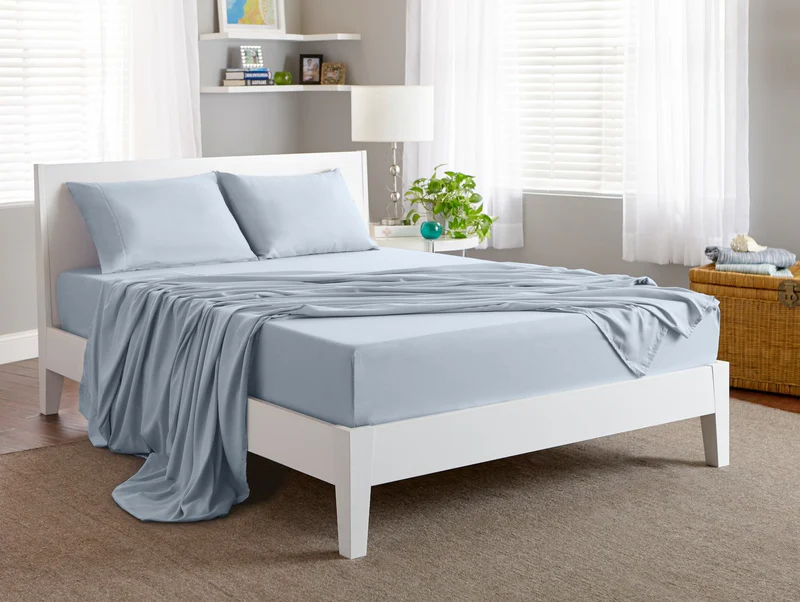 Bedgear Basic Sheets in light blue color on a modern bed, showcasing comfort and style, ideal for enhancing sleep quality, featured on Midwest Mattress Company product page.