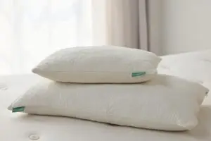 Avocado Latex Pillows stacked on a mattress, showcasing eco-friendly materials and breathable design for optimal sleep comfort and spinal alignment.